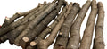 Log pieces on a wooden surface with a blurred background